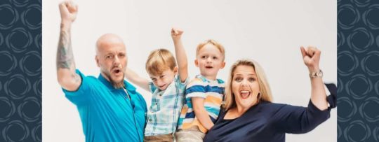 A family of four cheering