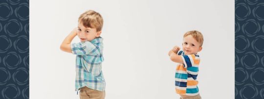 Two young boys pose for a photo