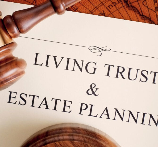 Gavel resting on estate planning document, legal and financial services for living trust and estate planning.