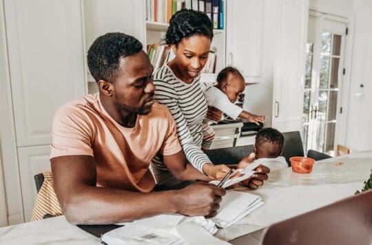 Family looking at paper
