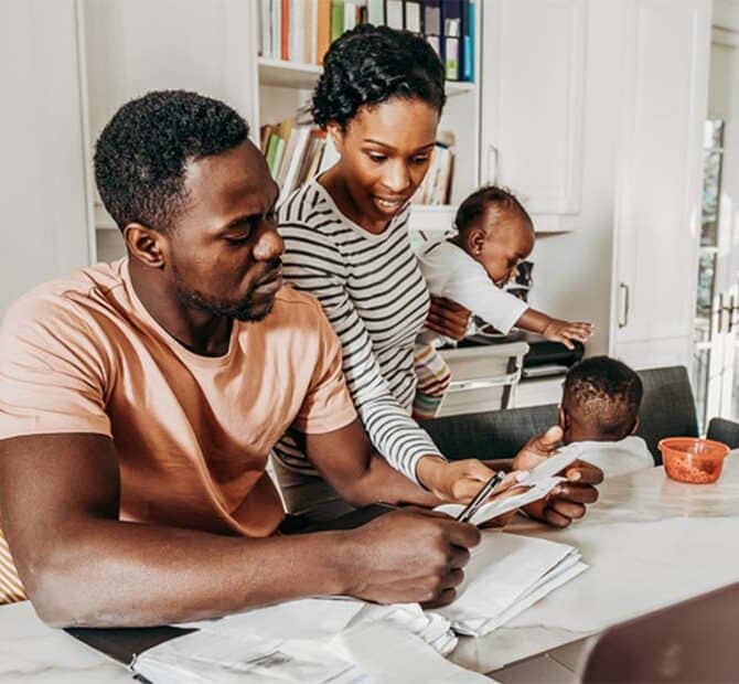 Family looking at paper