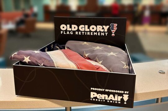 Folded American Flags in Old Glory Flag Retirement box