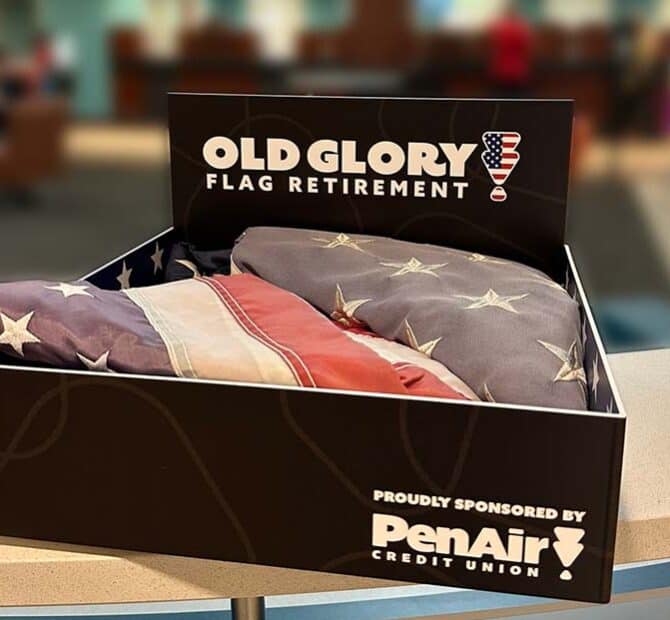 Folded American Flags in Old Glory Flag Retirement box