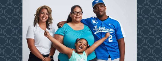 A family of three posing with their financial advisor