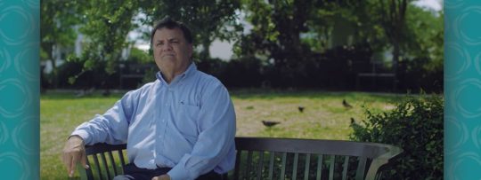 NOW team Jack sitting on a bench