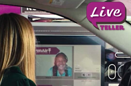 female drive pulls up to the LIVE Teller at PenAir Credit Union and interacts with onscreen employee