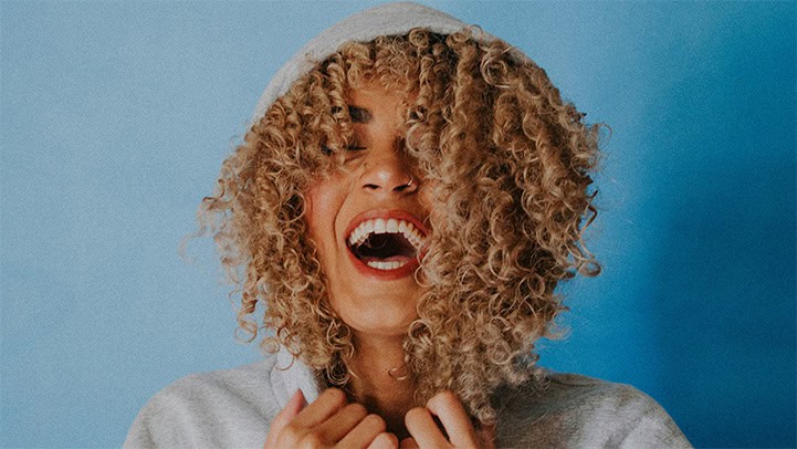 woman holding hoodie