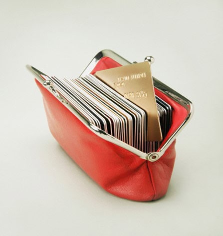 Red wallet loaded with credit cards